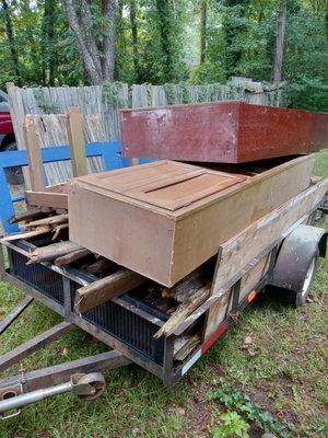 Newly renovated Deck, old cabinets, bookshelf, construction debris