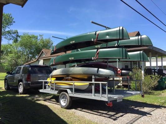 His trailer full of maintained canoes and kayaks