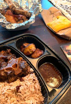 Oxtail with plantains, jus, rice/beans, plantains.  Beef Patty. Jerk Wings.   Simply delicious and full of flavor.