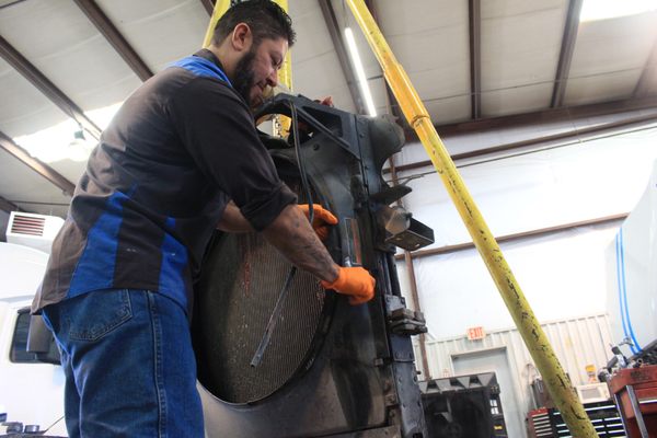 Victor replacing a broken radiator