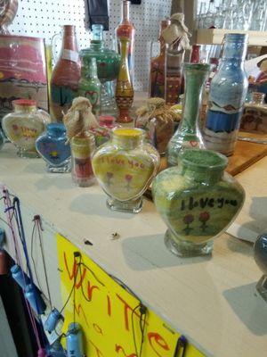 Original one of a kind sand art in bottles. Many different sizes, shapes and images..