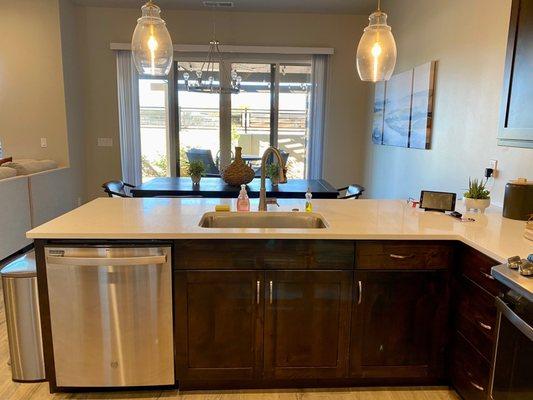 Kitchen with patio in background. There is a spa and gas barbecue.