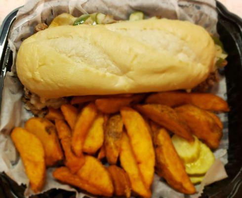 The Philly cheesesteak with potato wedges.