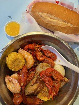 SPECIAL 1: 1/2 lb. Shrimp (head on), 1/2 LB Crawfish, 1 corn, 1 potato, 1egg with house sauce, and French bread