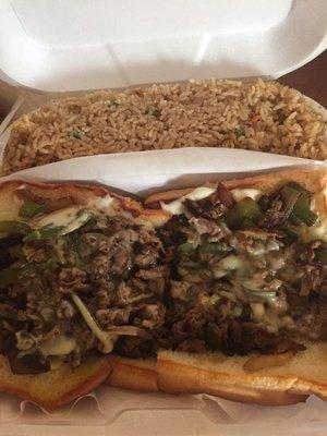 Huge philly cheese sandwiches with fried rice.