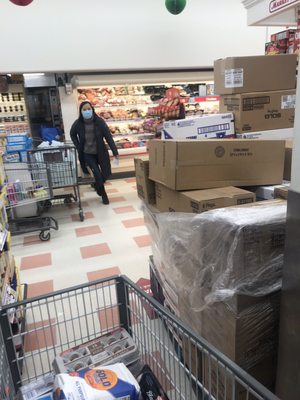 Pallet barely allows for cart to pass.