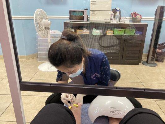 when getting pedi they have a covid shield up to protect nail technicians