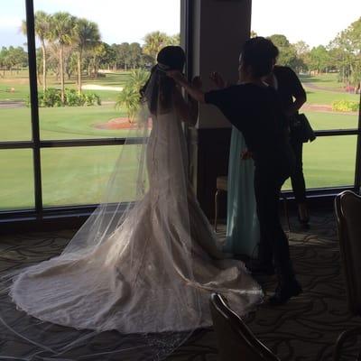 Jessica helping the bride get ready to walk down the aisle!