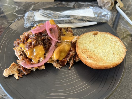 Legit Boss House slow-roasted pulled pork, cheddar cheese, pickled onions, bacon jam, brioche bun