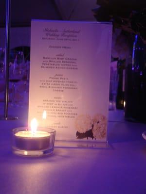 Custom designed wedding menu on display for guests.