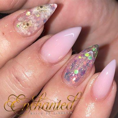 All acrylic short stiletto nails with flower encapsulation