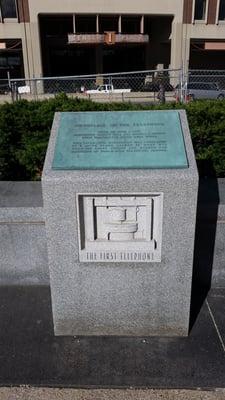 Plaque commemorating the first telephone outside JFK Federal Building