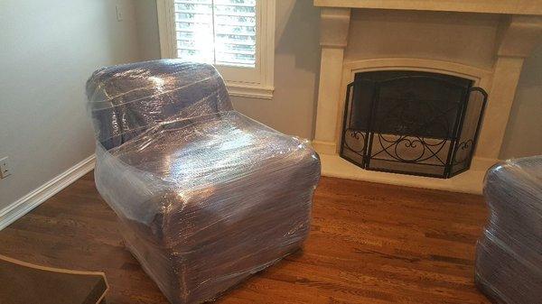 You can only see the shape of this leather chair because we wrapped it up so well. Prep work makes for a great moving experience.