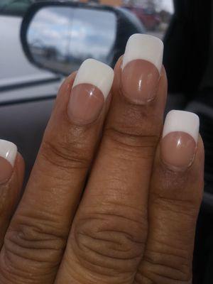 Photo of nails with excessive white tips. Half of the nails are white tips.  These do not look natural at all.