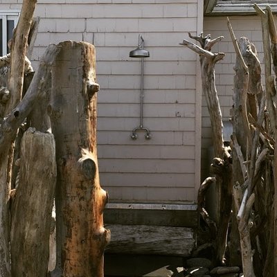 Custom outdoor shower with driftwood enclosure