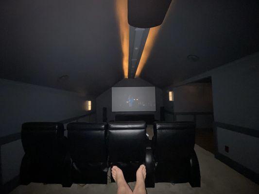 Home theater putting up my feet to watch a movie on the 120 inch 4 k screen!