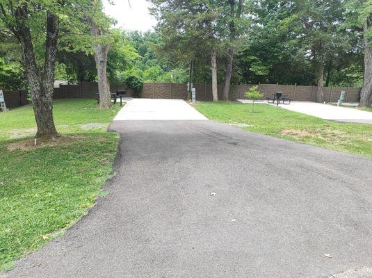 This is a shot of an unoccupied site. Some are on gravel, some are like this. These with the poured cement are huge.