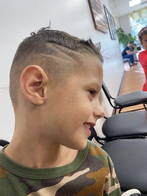 My son's cut -- high and tight with a lightning bolt on the side. He loves it!