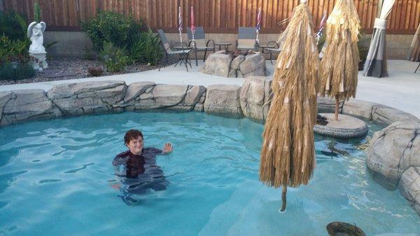 Happy clients enjoying their sculpture rock pool in San Jacinto.