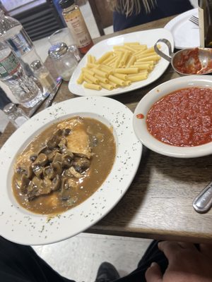 Chicken Marsala with a side of pasta and sauce on the side