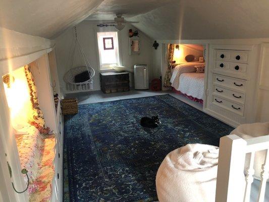 Newly renovated attic space with updated electrical lights and outlets and new windows