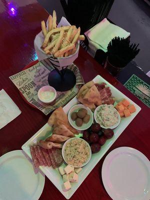 The Pop Board: A plate of meats, cheeses, specialty olives, fruits, warm pita wedges, a light hummus dip and a VERY REFRESHING spinach dip.