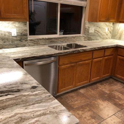 Fantasy Brown Kitchen countertops With full backsplash and mitered Edge