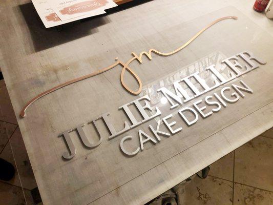 Custom CNC routed dimensional signage. Clear substrate with aluminum overlaid lettering.