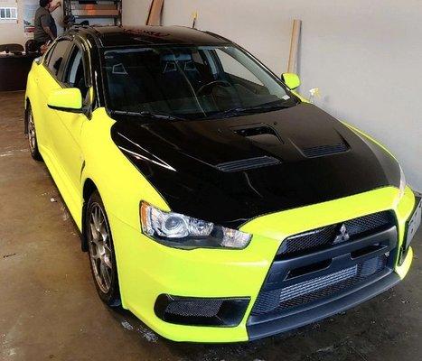 Full wrap in 3M satin fluorescent yellow topped with gloss black accents