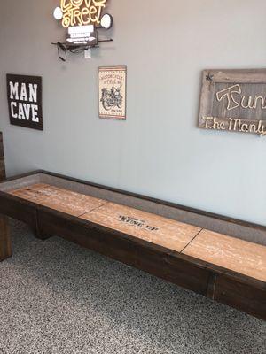 Shuffle board!!!  Way cool!  Will bring my son with me to get haircuts and play!!