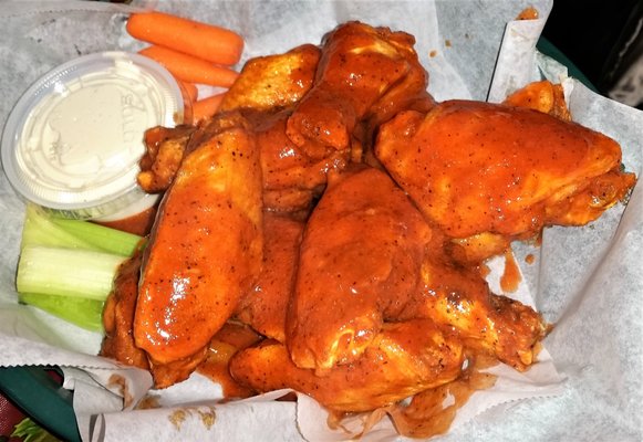 Wings w/ hot sauce.