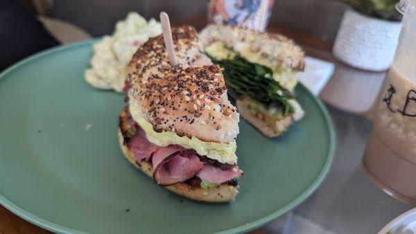 Ironman and destroyer bagel sandwich with side of potato salad.