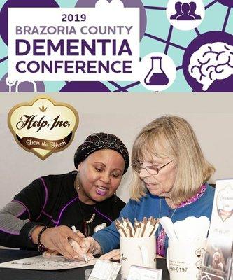 Caregiver and Client working on an activity at the annual dementia conference 2019.