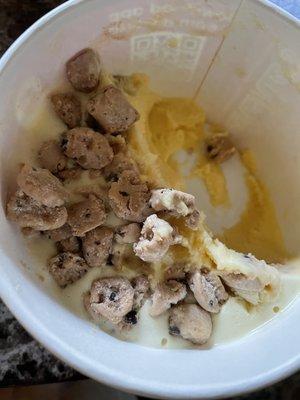 Amazingly delicious cake batter yogurt with cookie dough topping half.