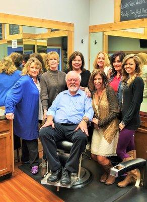 The barber shop crew surrounding award-winning barber, Randy McArthur. He has over 40 years experience and has been at VBS since 1979.