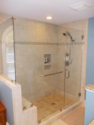 Frameless glass shower doors are sold and installed by TimberCreek Building and Design.