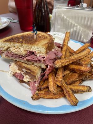 Reuben with sweet potato fries, pickles and coleslaw