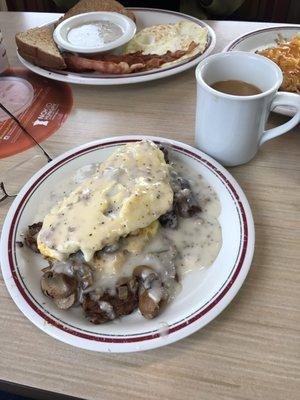 Beef tips, onions and mushroom omelette with sausage gravy! Yummy!