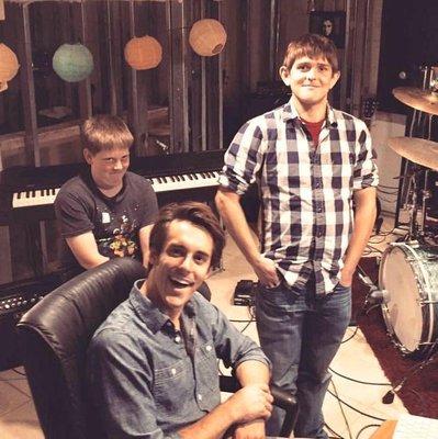 My brothers and I, in one of my first (under construction) drum rooms, in 2015.