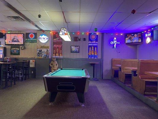 Pool table surrounded by plenty of seating