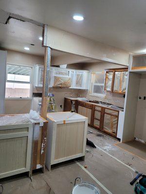 Cabinets being prepared to convert from stain to solid body paint color