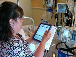 Nurse doing Point-of-Care Coding -- and you can too!  Be the first on your unit do learn ICD10PCS coding!