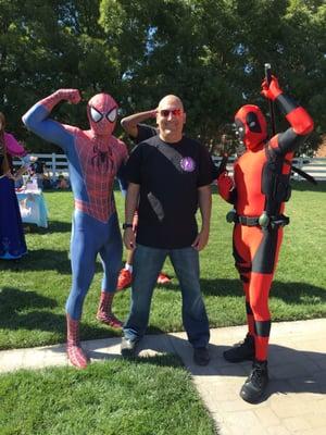 With Spiderman and dead Pool.  Djn A kids fundraiser at La Grande event center in Oakley