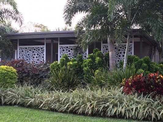 Decorative screen backdrop with lush garden foreground