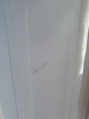 Burned sheer white curtains..multiple places.