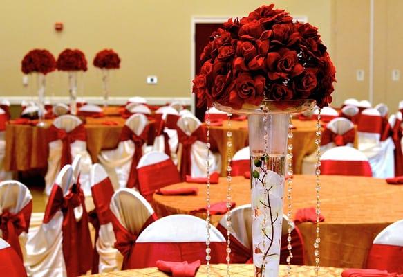 Our banquet hall accommodations set up for a wedding reception. Our rentals include tables and chairs.