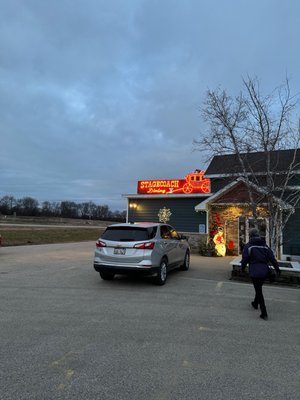 The neon sign which you can see from the road.