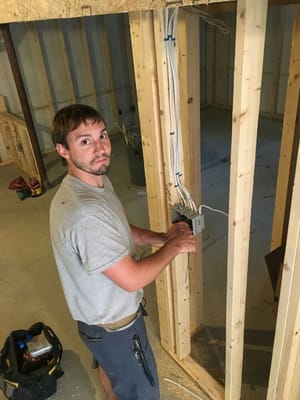 Chris Fraser (owner) working on a basement remodel.