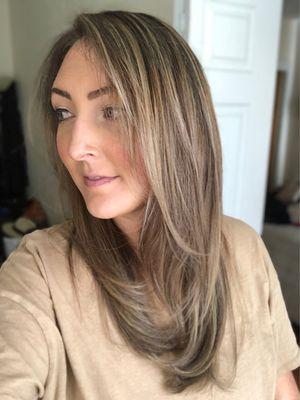 Full head of blonde highlights on dark brown hair- side view