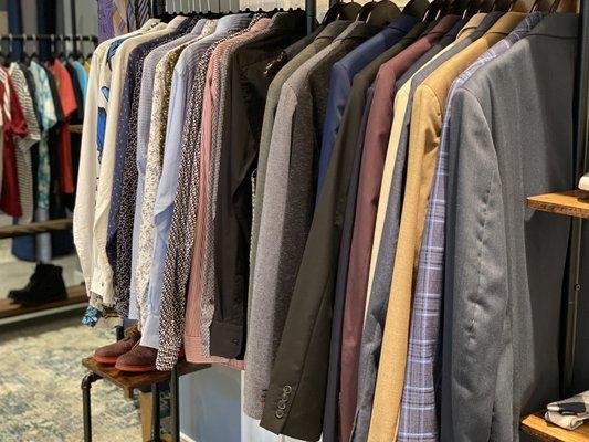 A selection of suits and button ups